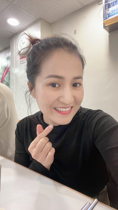 Portrait of Xiao Cui in her nail shop